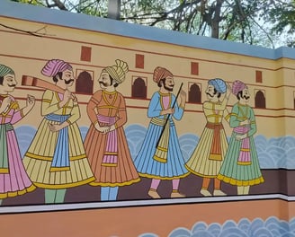 A wall painting of Indian men in traditional garments, reflecting the beautiful cultural expression and heritage.