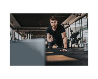 A personal trainer coaching an online PT session