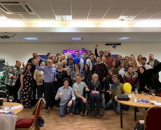 Image of a large group of Tim's friends and family at one of his quizzes.
