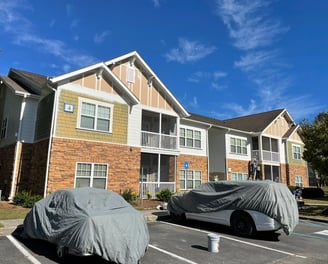 Exterior painting service on multi-family apartment building in Douglas, GA by Garnet Painting & Remodeling.