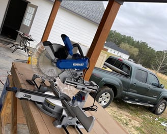 ofessional woodworking equipment set up for an outdoor carpentry project by Garnet Painting in Douglas, GA.