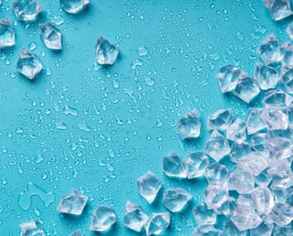 a bunch of ice cubes on a blue background