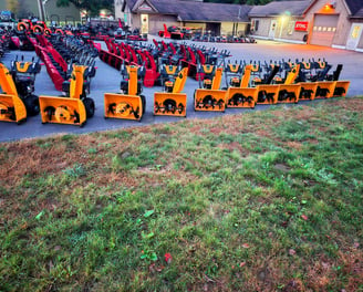 view of joes equipment as you approach it with a large assortment of snow blowers on display