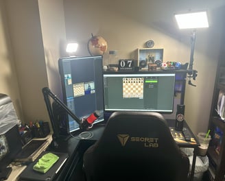 a desk with a computer monitor and a keyboard