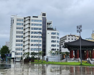 Jeonil Building 245 with the democracy bell in the foreground