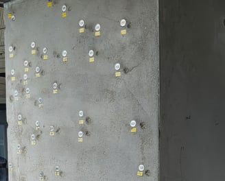 Supporting beam showing many bullet holes