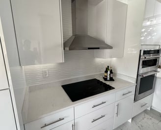 Before-and-after kitchen remodel showing wall removal and full layout redesign in Kissimmee resident