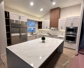 White kitchen makeover with subway tile backsplash and stainless steel appliances — expert remodelin