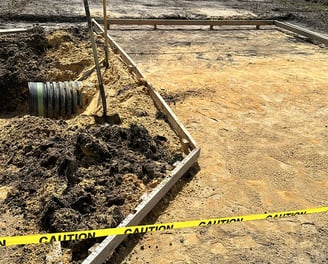 Residential driveway installation using pavers and compacted gravel base — expert exterior remodelin