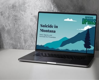 a laptop computer sitting on a table with a mountain view