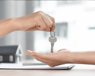 a person holding a key chain in their hand