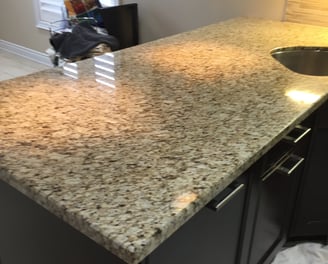 Finely polished Granite Kitchen Counter reflects light beautifully