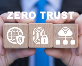 a person holding two wooden blocks with zero trust