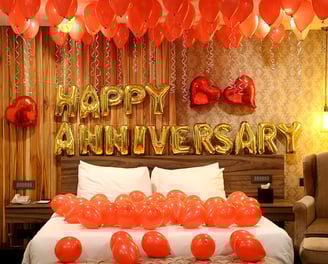 a bed with balloons and balloons on it