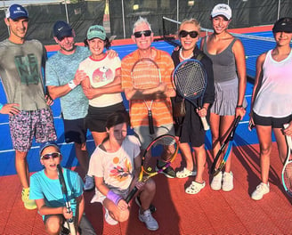 Adult tennis group enjoying sunny day in Panama City Beach, FL.