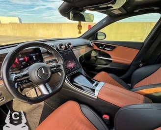 Mercedes C300 interior dashboard with leather seats and dual screen display