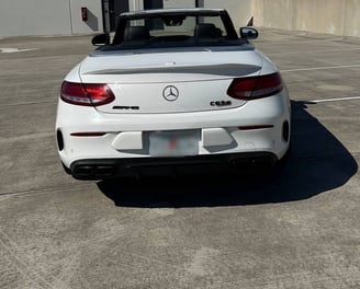 Back view of Mercedes C63s convertible showing AMG badging and quad exhausts