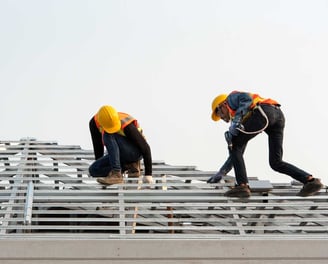 Men Installing House Roof Structure