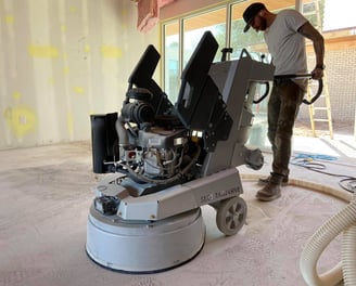 Concrete Grinding using a Lavina Propane floor grinder to remove thinset