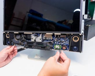 TV repair technician working on screen backlight in Patna