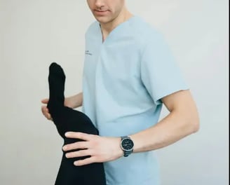 A physiotherapist with his patient