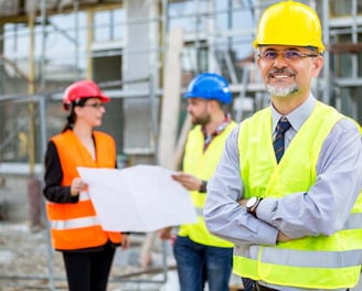 a man in a yellow safety vest and a woman in a yellow vest