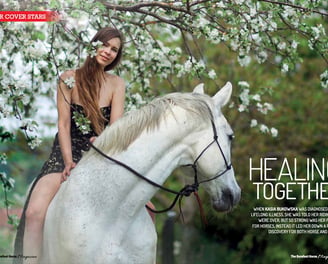 Kasia Bukowska riding bareback and bitless on her white horse.