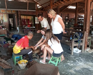 Artisan demonstrating traditional Pottery-making techniques in a Yogyakarta workshop.