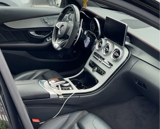 a car with a steering wheel and dashboard