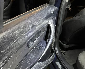 a car door with a door open and a car door open