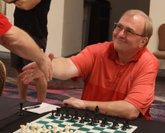 Vegas Chess Coach - Oliver Hemmers is shaking hands with his opponent in an OTB tournament.