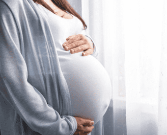 a pregnant woman with a white dress