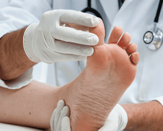 a doctor's testing the patient's foot