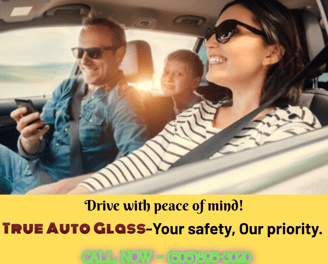 a woman driving a car with a man driving a car
