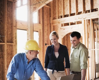 Contractor and homeowners planning home renovation project in London, Ontario.