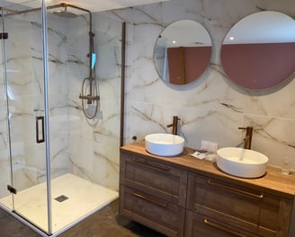 a bathroom with a shower and a sink