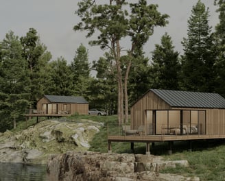 Prefab modular tiny homes by Wind River Builders on a lake