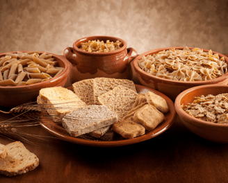 a table with bowls of food and bread