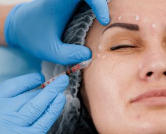 a woman getting a botoxoxation in a beauty salon