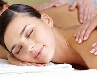 a woman getting a massage at a spa