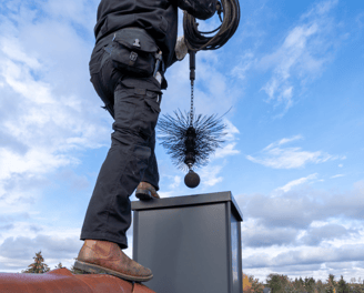 chimney sweeper on roof