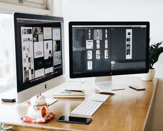 Two desktop with design opened in screen.