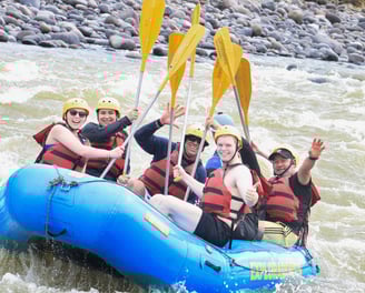 a group of people on raft raft raft rafting down a river