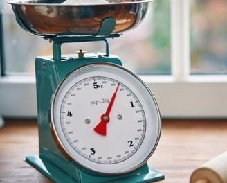 a kitchen scale with a rolling pin