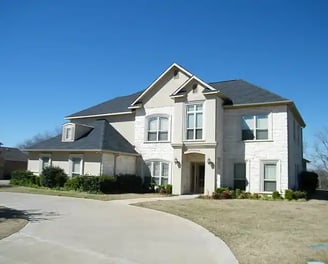 a house with a driveway and driveway with a driveway