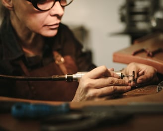 women-working-with-hands-and-tools-in-workshop-handmaking-metal-jewellery