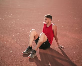 Young man sitting on floor