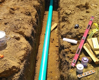 sewer line to building trench