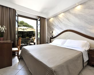 a bed room with a bed and a television