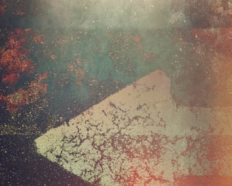 An abstract photograph of an arrow pointing to the left.